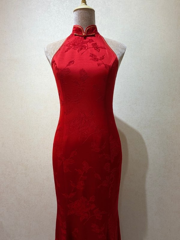 Crimson rose halter neck qipao with a streamlined, minimalist silhouette