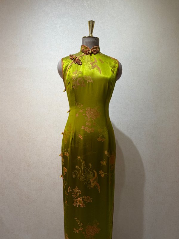Olive brocade sleeveless cheongsam in hand-loomed brocade with seamless pattern matching